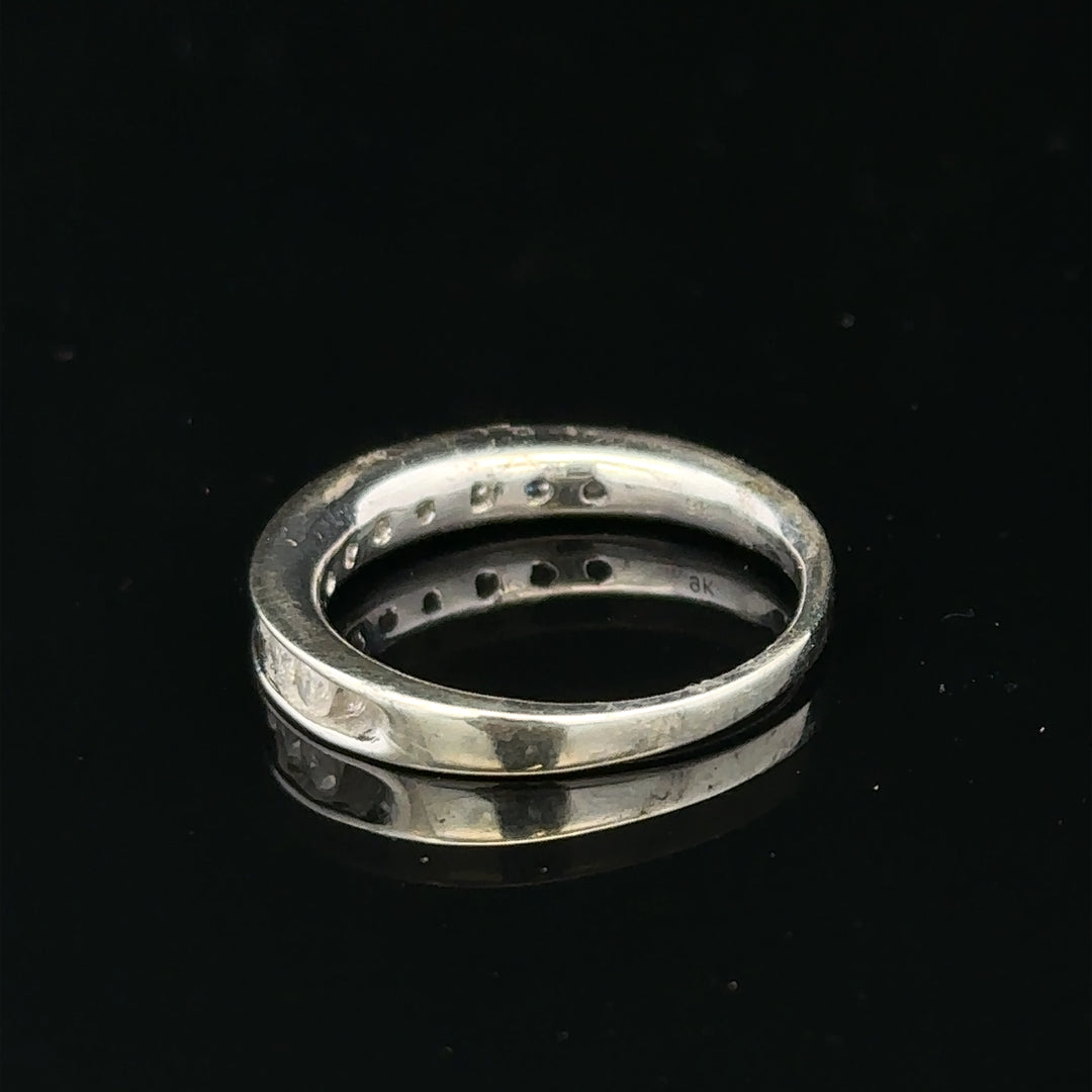 9ct white gold diamond ring in size J with sparkling diamonds and elegant design, showcasing a fine jewelry piece.