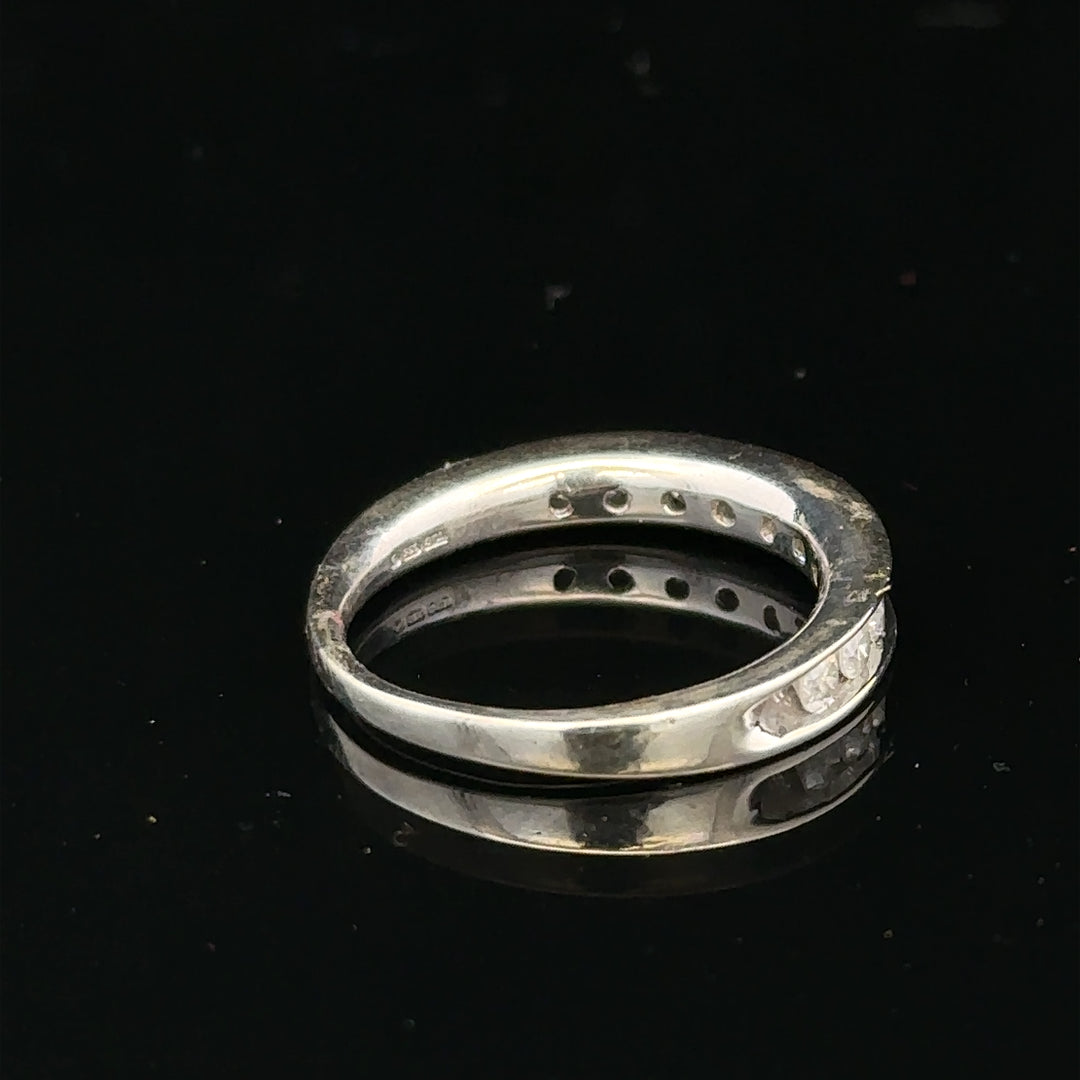 9ct white gold diamond ring in size J with sparkling diamonds, elegant jewelry piece, unbranded, close-up view of the ring.