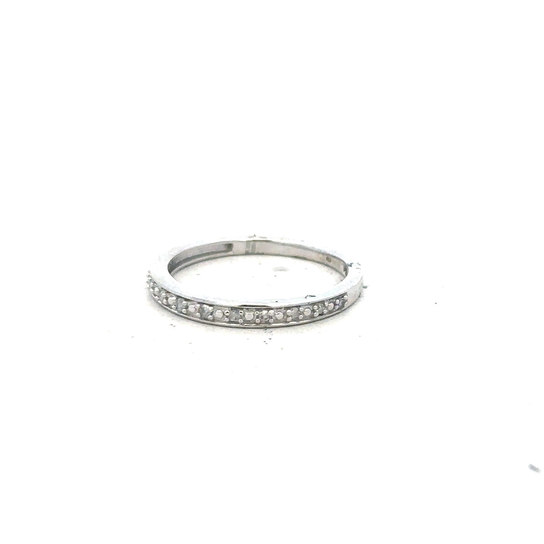 9ct white gold diamond ring size J1/2 with sparkling diamonds, showcasing elegant craftsmanship and a sleek, polished finish.