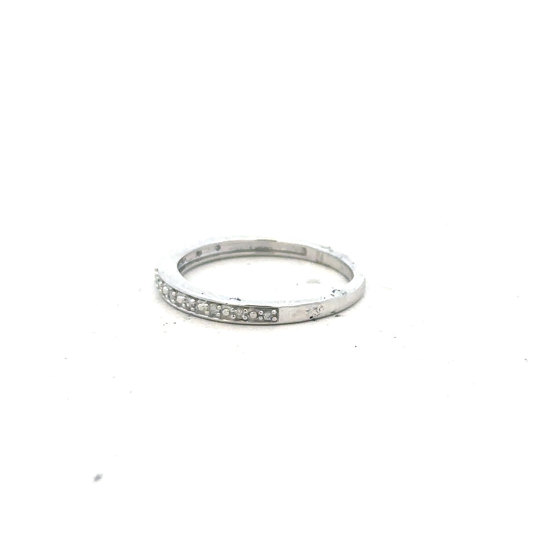 9ct white gold diamond ring in size J1/2 with sparkling diamonds, showcasing elegant jewelry craftsmanship.