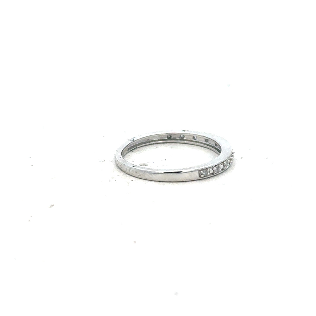 9ct white gold diamond ring in size J1/2 with sparkling diamonds, elegant jewelry piece with a polished finish.