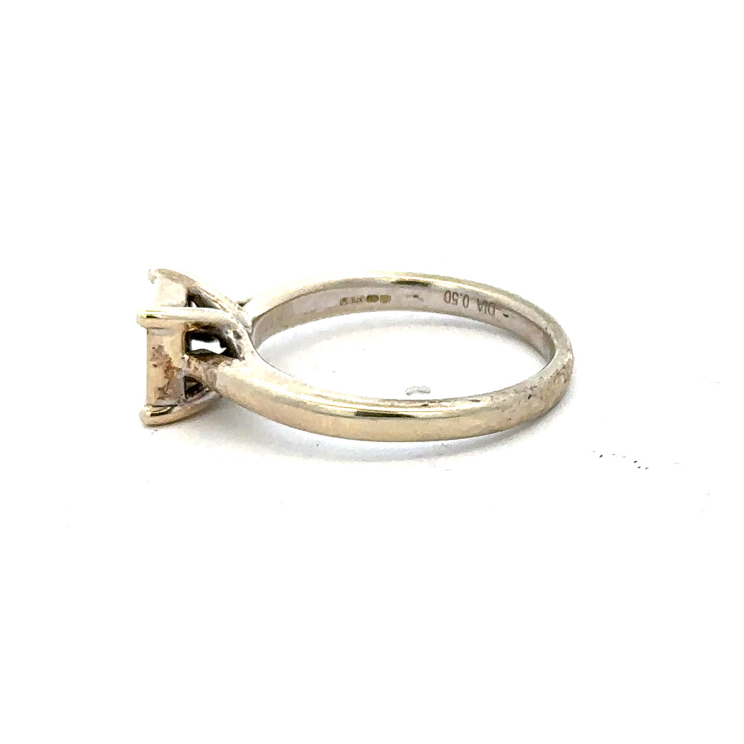 9ct white gold diamond ring in size L1/2 with a sparkling diamond, showcasing an elegant and classic jewelry design.