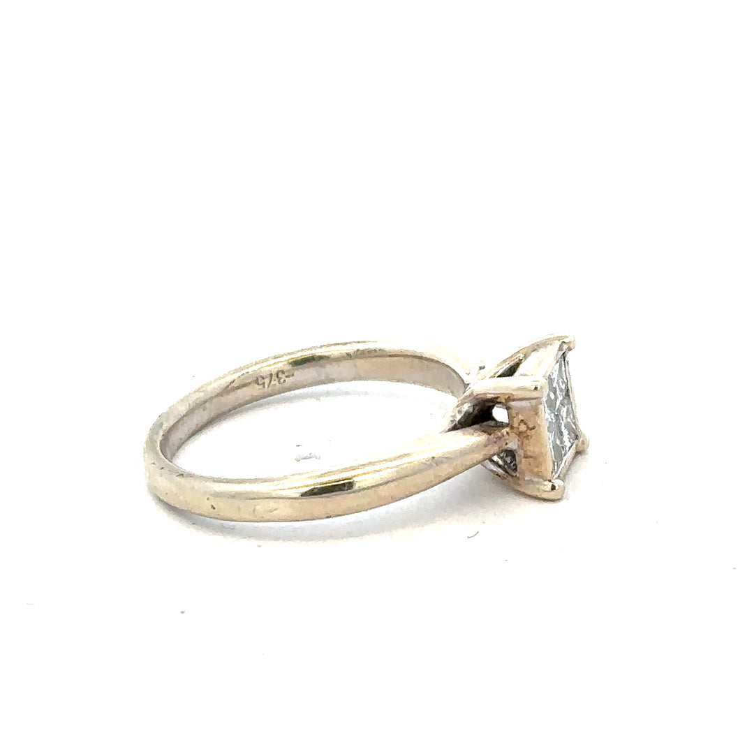 9ct white gold diamond ring in size L1/2, featuring a sparkling diamond set in a sleek band.