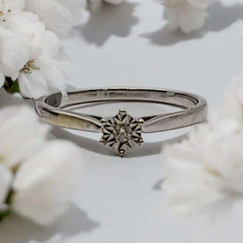 9ct white gold diamond ring in size N with sparkling diamonds, showcasing elegant jewelry craftsmanship.