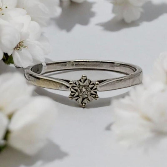 9ct white gold diamond ring in size N with sparkling diamonds, showcasing elegant jewelry craftsmanship.