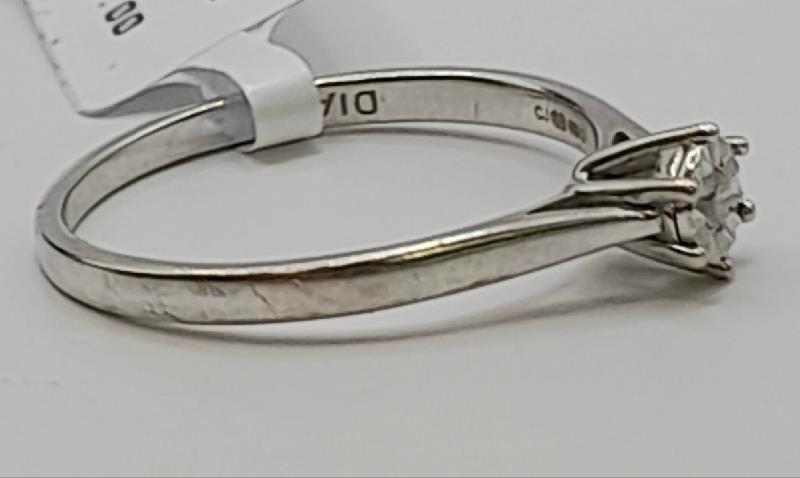 9ct white gold diamond ring in size N with sparkling diamonds, showcasing elegant craftsmanship and a sleek design.