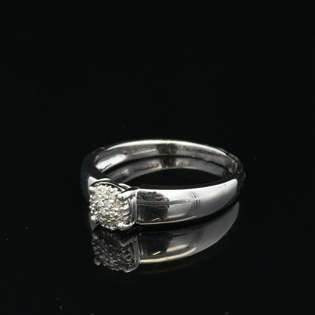 9ct white gold diamond ring with a central diamond, size N1/2, featuring a sleek band and sparkling gemstone.