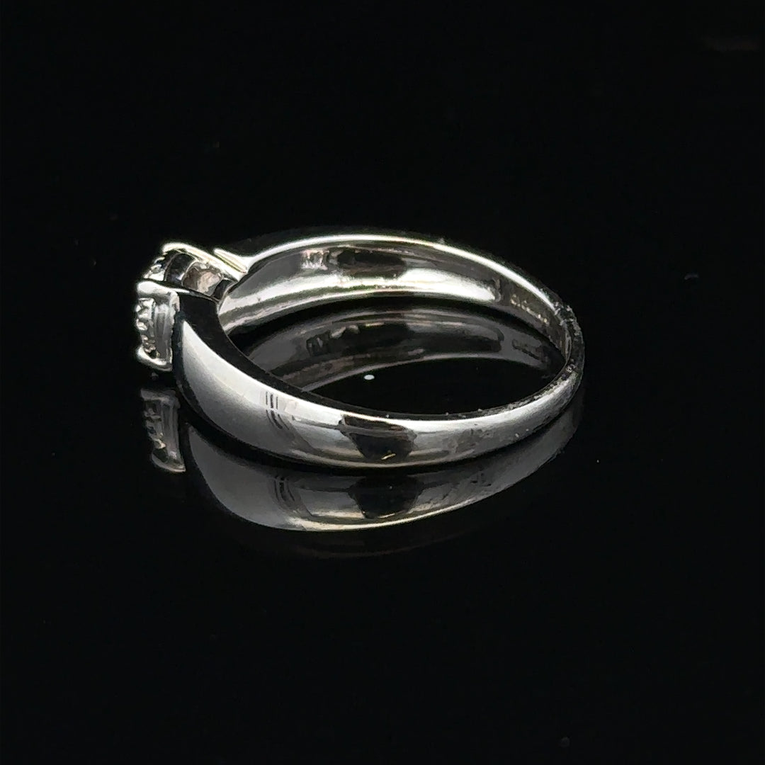 9ct white gold diamond ring in size N1/2 with sparkling diamonds, showcasing elegant jewelry design.