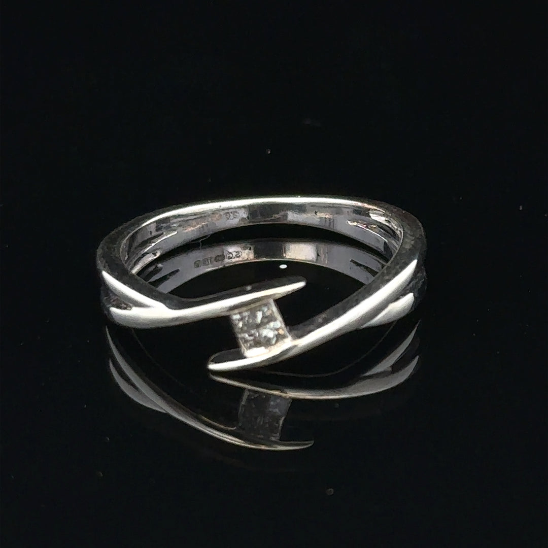9ct white gold diamond ring in size O with a sparkling diamond, showcasing elegant jewelry design.