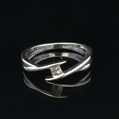 9ct white gold diamond ring in size O with a sparkling diamond, showcasing elegant jewelry design.