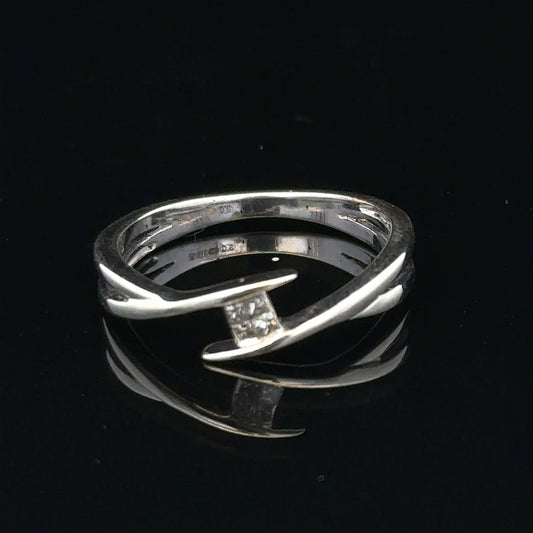 9ct white gold diamond ring in size O with a sparkling diamond, showcasing elegant jewelry design.