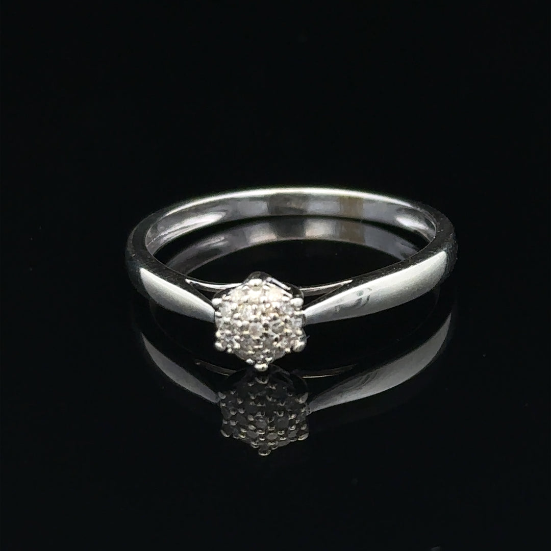 9ct white gold diamond ring in size R1/2, featuring a sparkling diamond set in a sleek, elegant band.