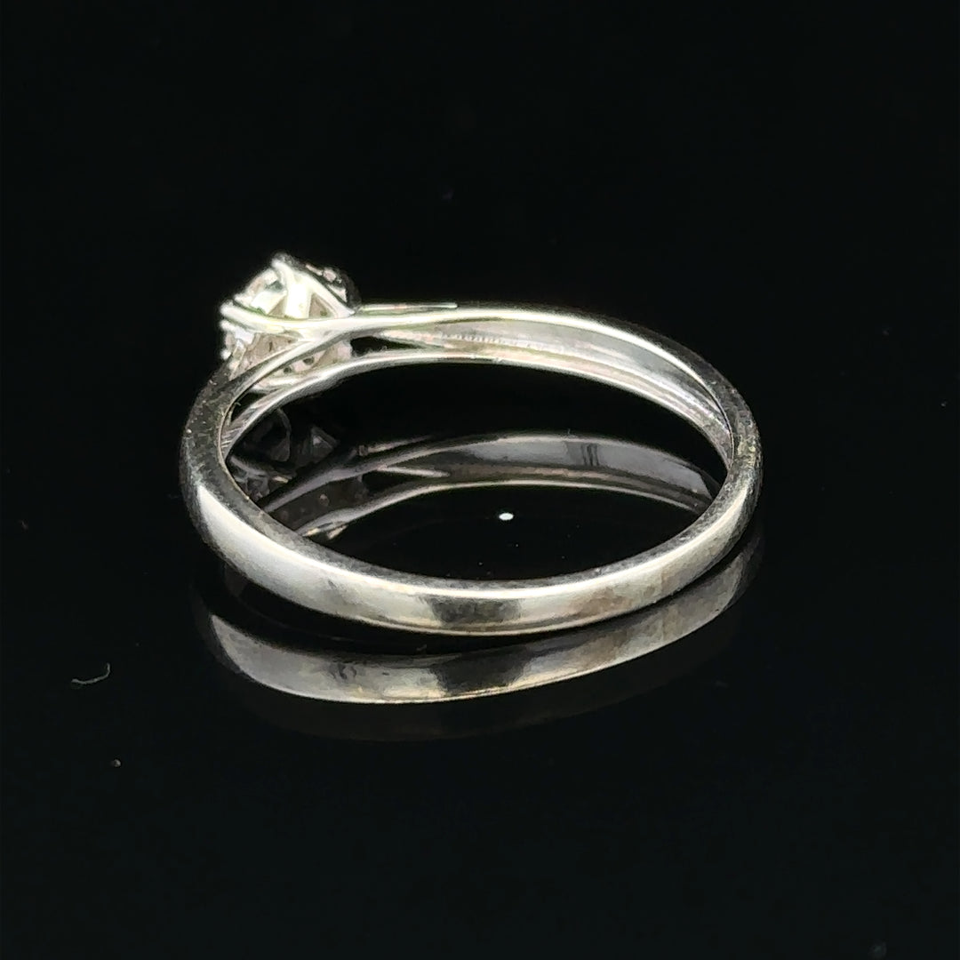 9ct white gold diamond ring in size R1/2, featuring a sparkling diamond set on a sleek band.