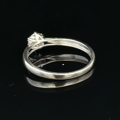 9ct white gold diamond ring in size R1/2, featuring a sparkling diamond set on a sleek band.