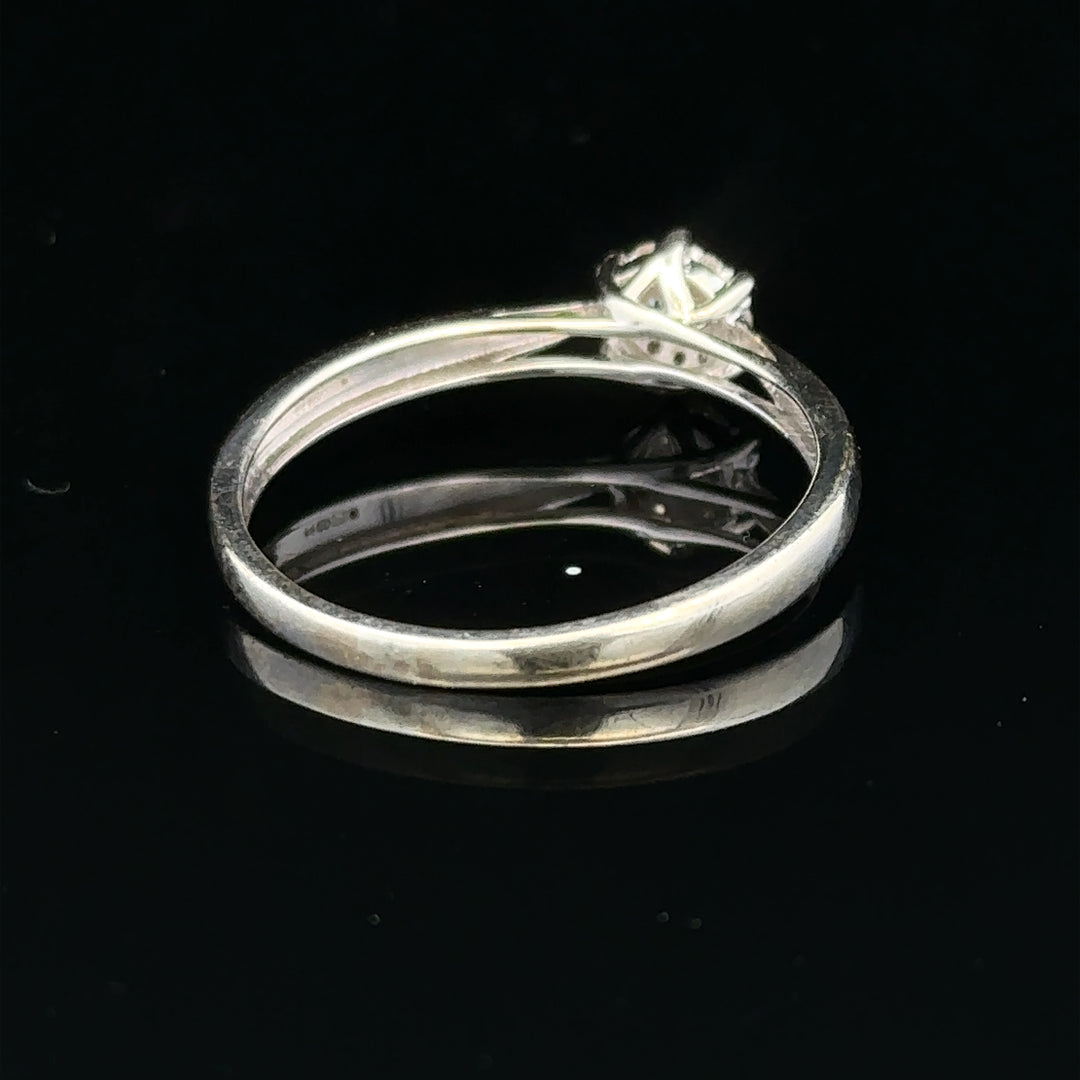 9ct white gold diamond ring size R1/2 featuring a sparkling diamond set in elegant gold band.