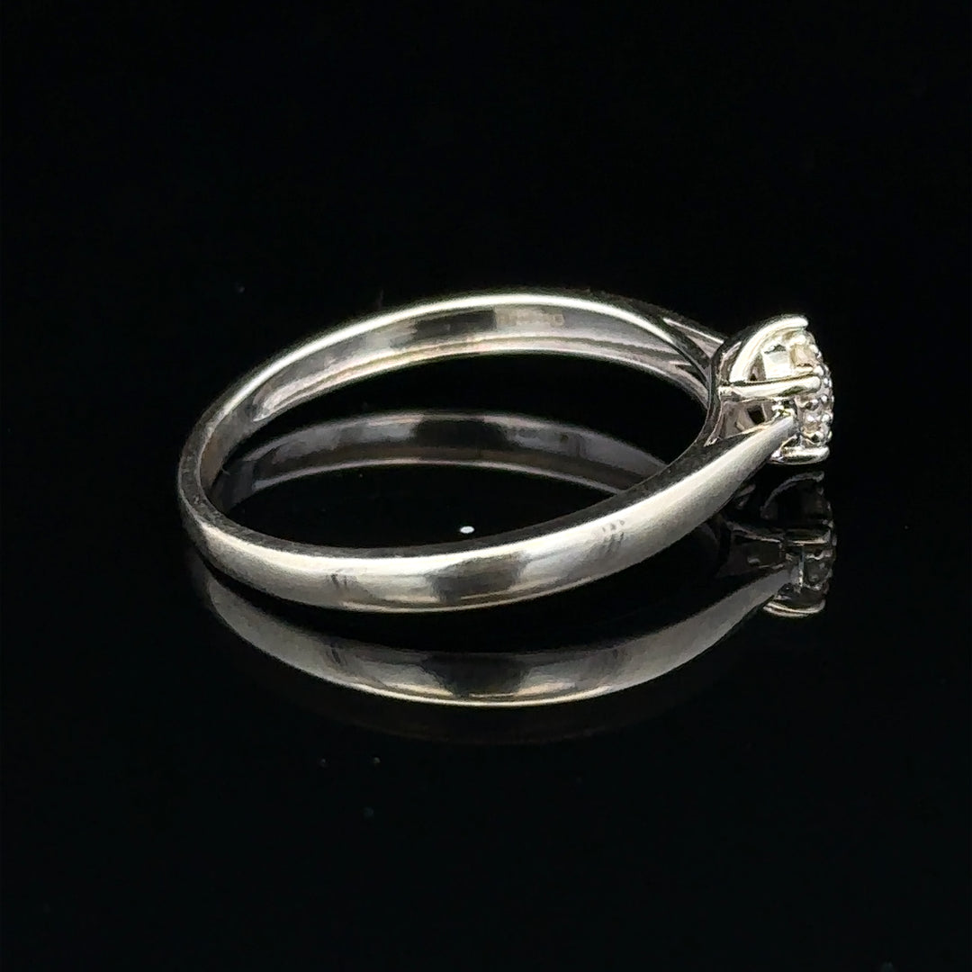 9ct white gold diamond ring in size R1/2 with sparkling diamonds, showcasing elegant jewelry craftsmanship.