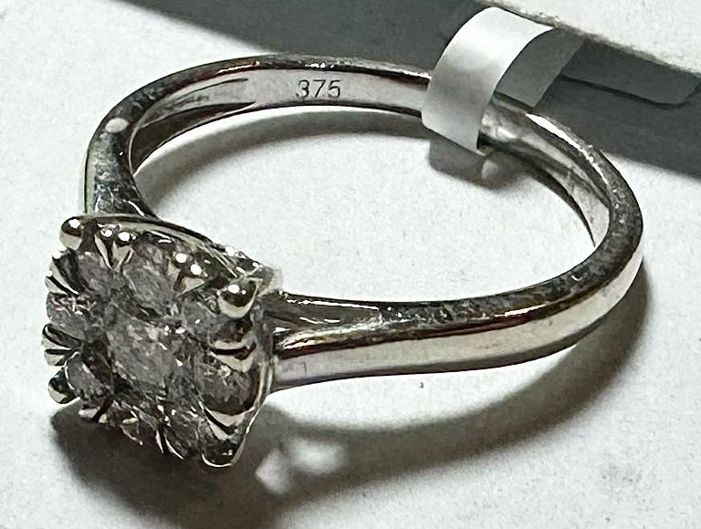 9ct white gold lab-grown diamond ring in size M, featuring a sparkling diamond centerpiece and sleek band design.