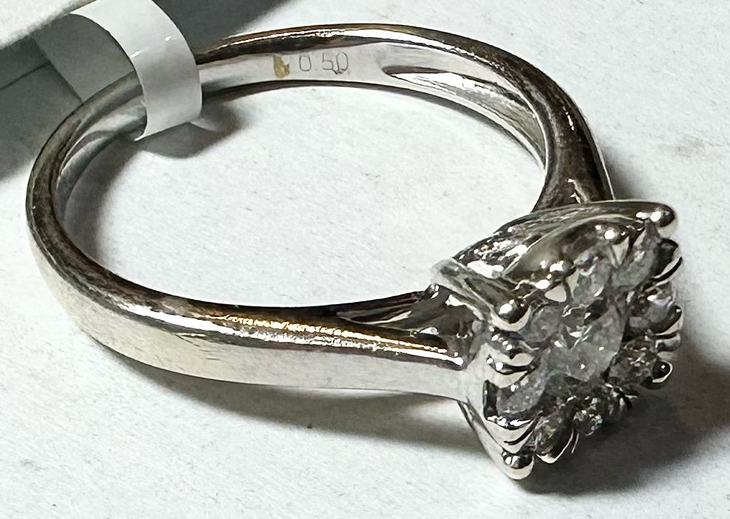 9ct white gold lab-grown diamond ring in size M, featuring a sparkling diamond center and a sleek band design.