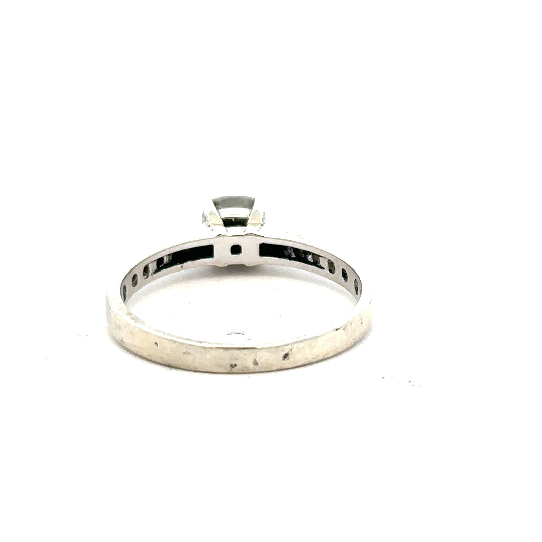 9ct white gold mossainte ring in size R, showcasing a delicate band with intricate mossainte gemstone detailing.