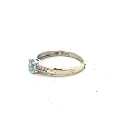 9ct white gold ring in size L with a smooth band, unbranded jewelry displayed on a neutral background.