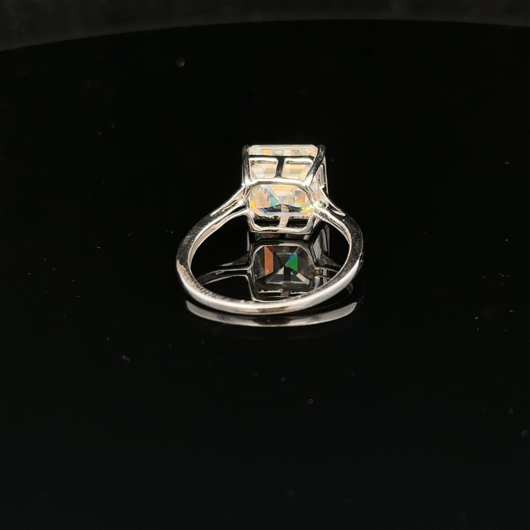 9ct white gold ring in size L with a smooth band, showcasing a sleek and polished jewelry piece.