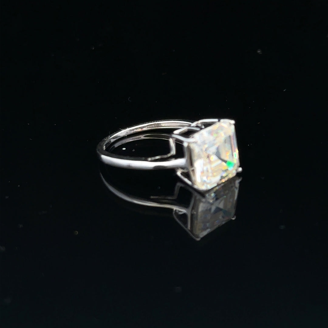 9ct white gold ring in size L with a smooth, polished band, unbranded, showcasing elegant jewelry craftsmanship.