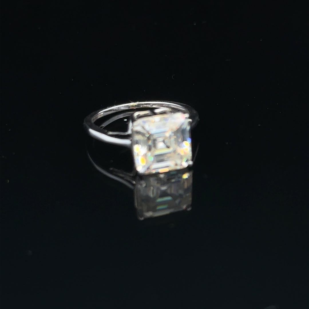 9ct white gold ring in size L with a sleek, polished finish, showcasing a simple and elegant design.
