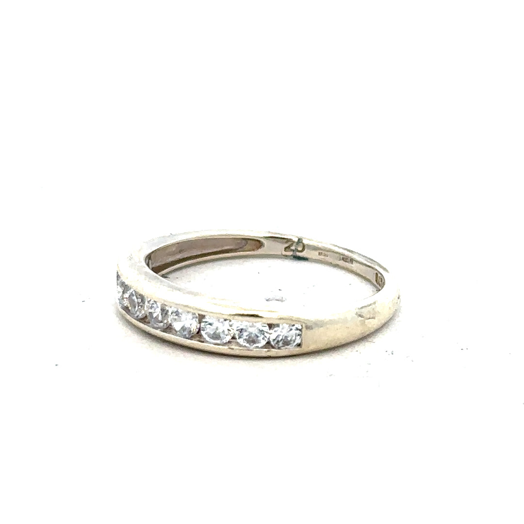 9ct white gold ring in size L with a smooth, polished band, displayed on a neutral background showing close-up detail.