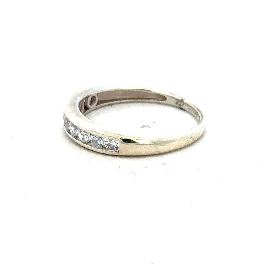 9ct white gold ring in size L with a smooth polished band, unbranded jewelry showcasing elegant craftsmanship.