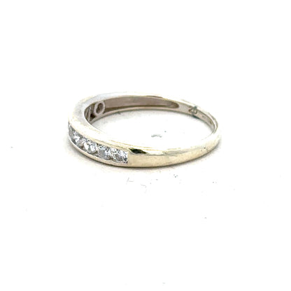 9ct white gold ring in size L with a smooth polished band, unbranded jewelry showcasing elegant craftsmanship.