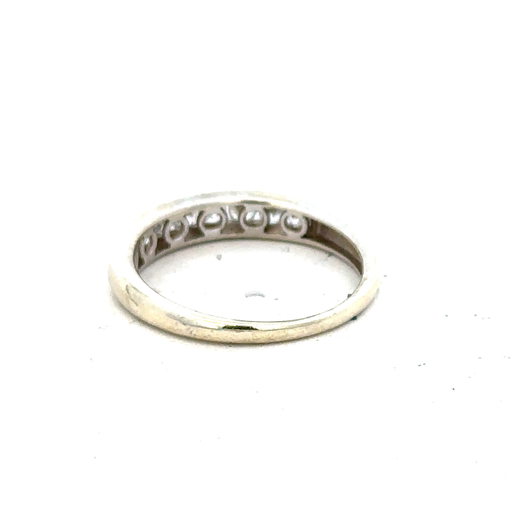 9ct white gold ring in size L with a smooth polished band, unbranded, shown on a plain background for close-up detail.