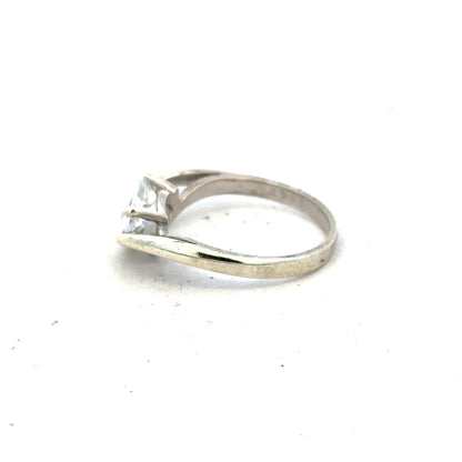 9ct white gold ring in size O with a smooth polished band, showcasing a sleek and elegant jewelry design.