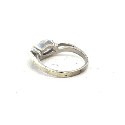 9ct white gold ring in size O with a smooth band, unbranded jewelry, displayed on a neutral background.