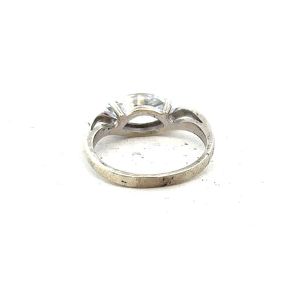 9ct white gold ring in size O with a smooth band, unbranded jewelry showcasing elegant craftsmanship.