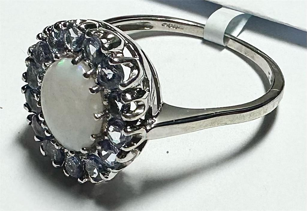 9ct white gold ring in size S with a smooth band, featuring a polished finish and elegant design.