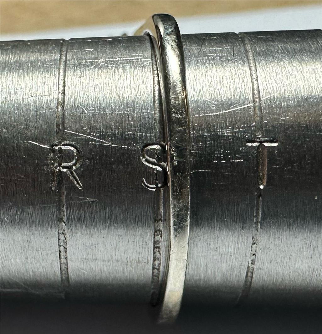 9ct white gold ring in size S with a sleek, polished finish, featuring a simple elegant design.