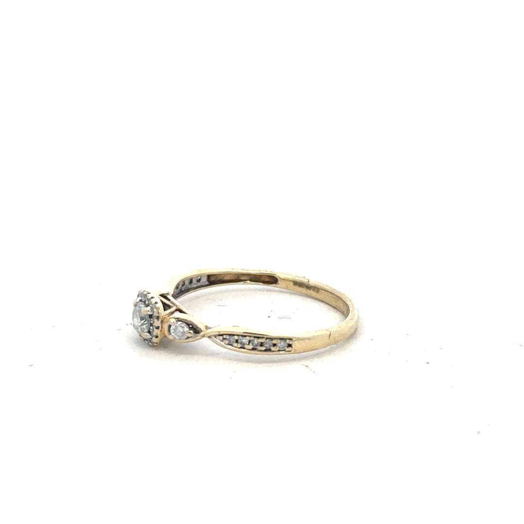 9ct yellow gold diamond ring with 0.33 carats, size S, featuring a sparkling central diamond and elegant design.
