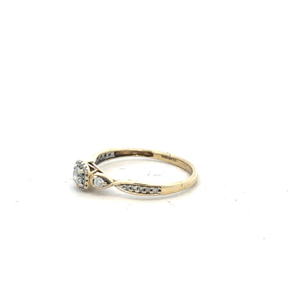 9ct yellow gold diamond ring with 0.33 carats, size S, featuring a sparkling central diamond and elegant design.