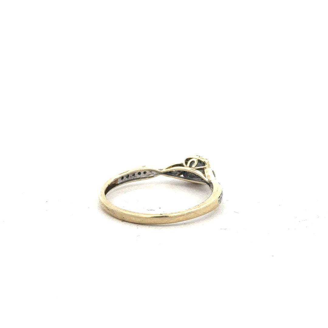 9ct yellow gold diamond ring with 0.33ct center stone, size S, featuring elegant design and sparkling diamonds.