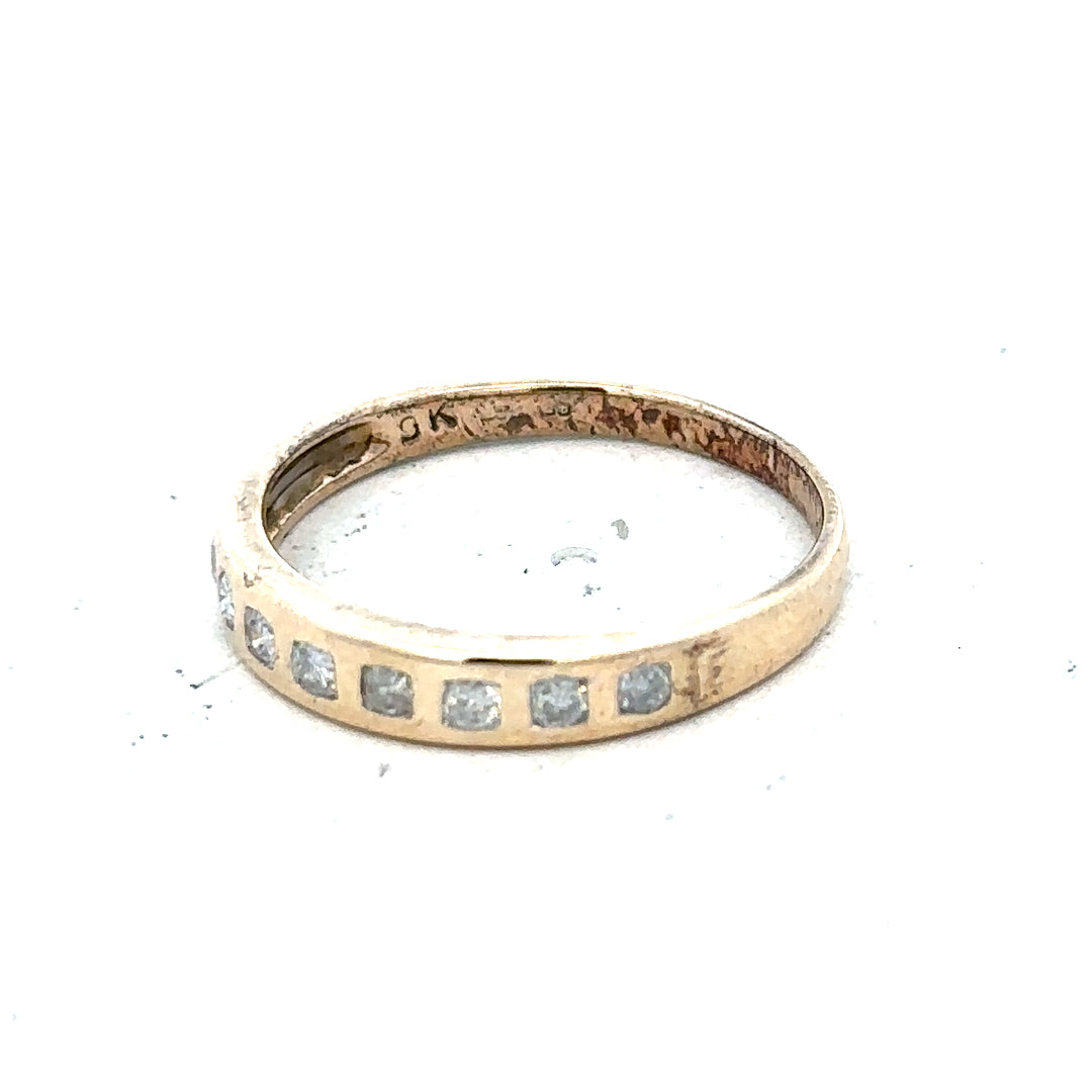 9ct yellow gold diamond ring with 1/4 carat total weight, size O, featuring a sparkling central diamond.