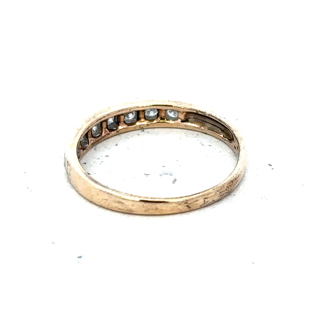 9ct yellow gold diamond ring with 1/4 carat center stone, size O, featuring a sleek band and sparkling diamonds.