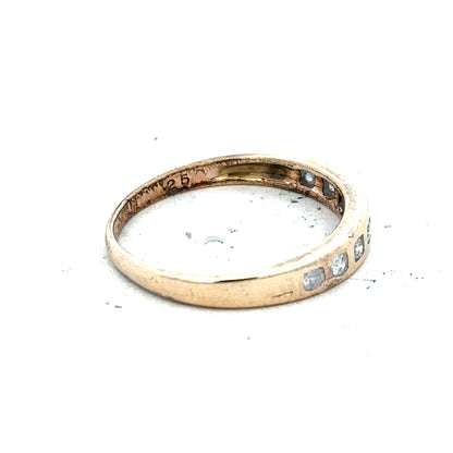 9ct yellow gold diamond ring with 1/4 carat round cut diamonds in size O, featuring a sleek and elegant design.