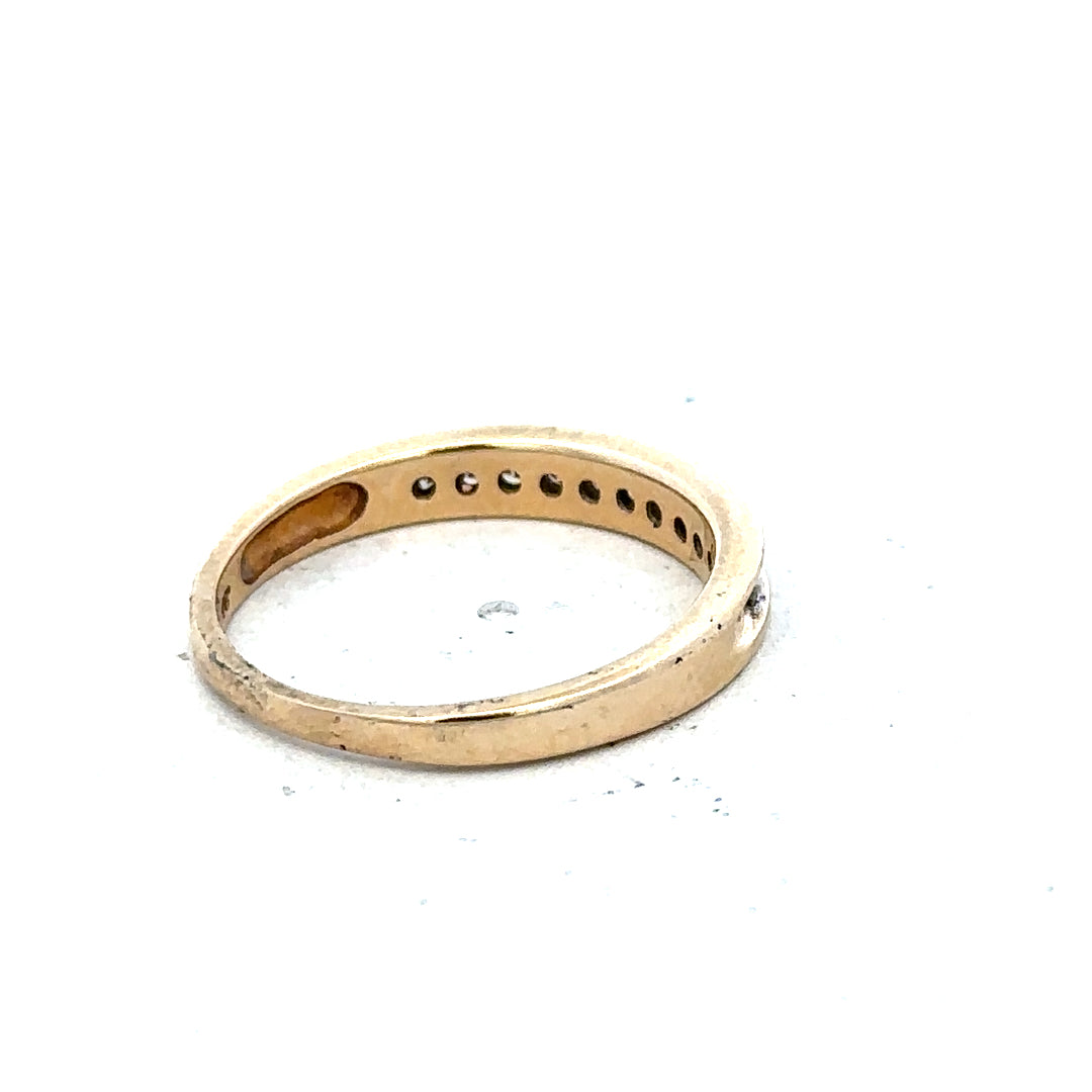 9ct yellow gold diamond ring with 1/4 carat total weight, size O 1/2, featuring a simple and elegant design.