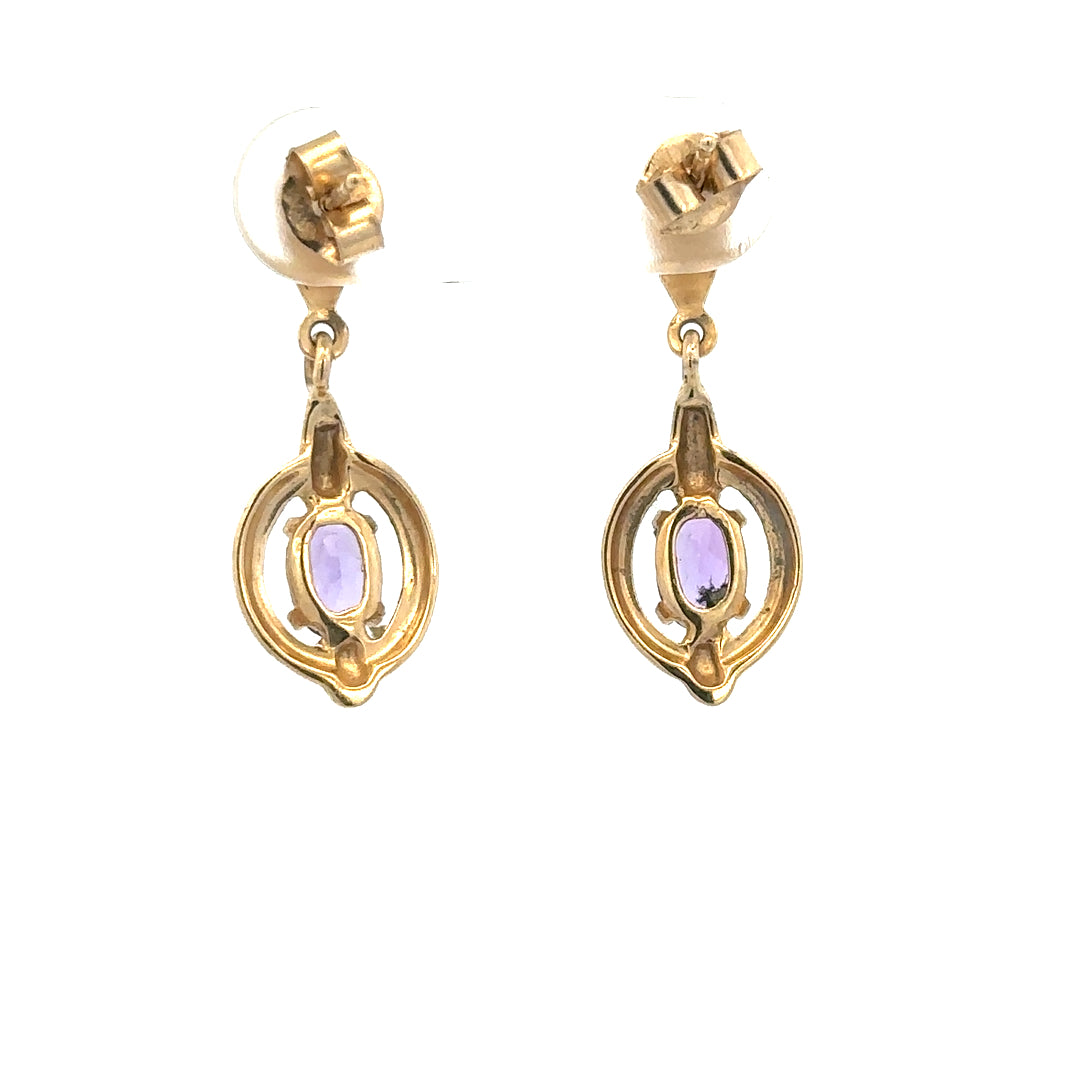 Pair of 9ct yellow gold amethyst earrings with 2.1g weight, featuring vibrant purple gemstones set in elegant gold settings.