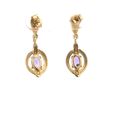 Pair of 9ct yellow gold amethyst earrings with 2.1g weight, featuring vibrant purple gemstones set in elegant gold settings.