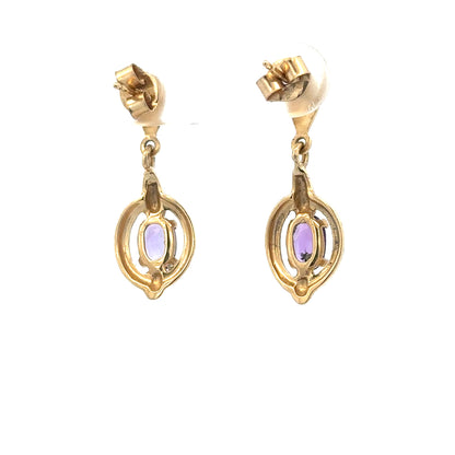 9ct yellow gold amethyst earrings featuring purple gemstones and delicate design, weighing 2.1g, unbranded jewelry.
