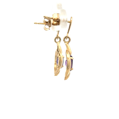 9ct yellow gold amethyst earrings with purple gemstones and gold hooks, weighing 2.1 grams.