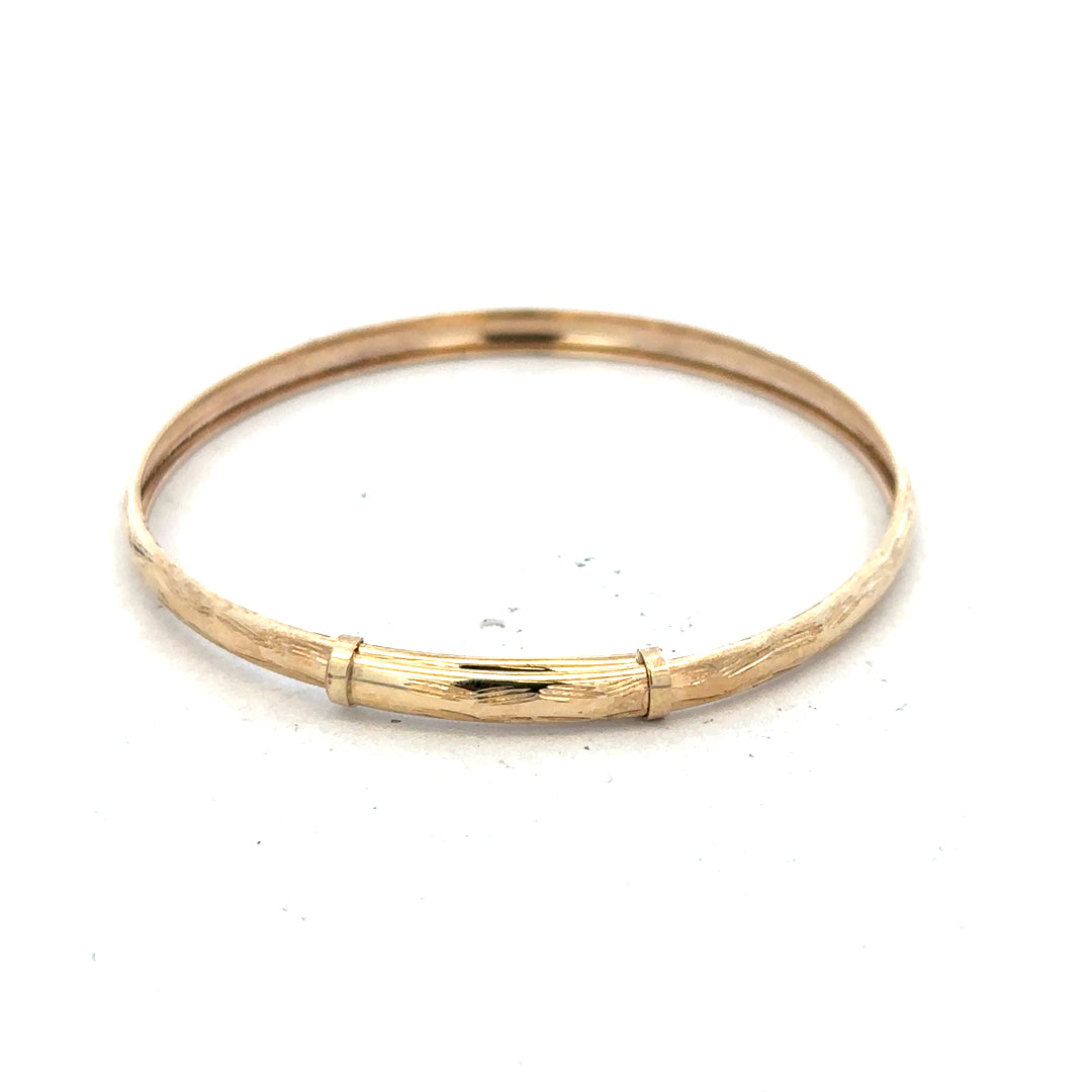 9ct yellow gold bangle weighing 1.7g, unbranded jewelry accessory, showcasing a sleek and polished design.