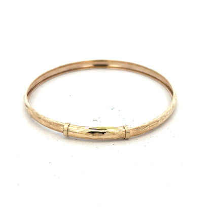 9ct yellow gold bangle weighing 1.7g, unbranded jewelry accessory, showcasing a sleek and polished design.