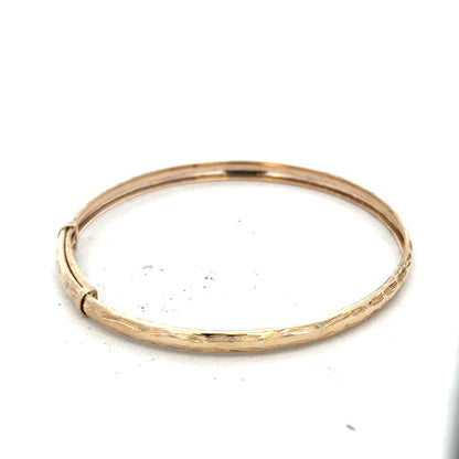 9ct yellow gold bangle with lightweight design, weighing 1.7g, featuring a sleek and polished finish.